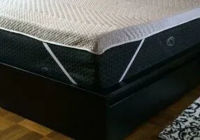 Corner Of A Bed With A BioPosture Mattress Topper