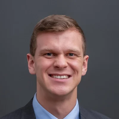 Chiropractor Fitchburg WI Adam Considine About Chiropractor Adam Considine Smiling In Suit Top