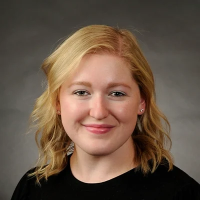 Chiropractor Fond du Lac WI Taylor Schregardus About Chiropractor Taylor Schregardus Smiling In Black Top
