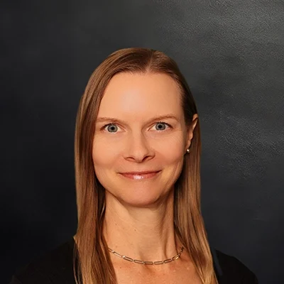 Chiropractor Julie Qualle Smiling in Black Top