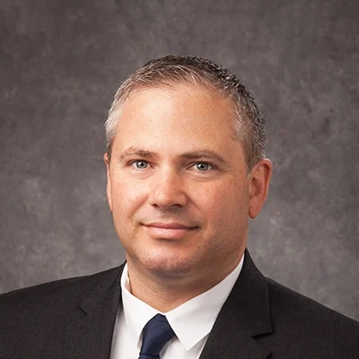 Chiropractor Verona WI Paul Morovits About Chiropractor Paul Morovits Smiling In Grey Suit With Navy Tie