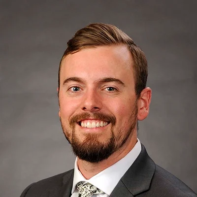 Functional Medicine Madison WI Sam Blum About Doctor Of Physical Therapy Sam Blum Smiling Grey Suit